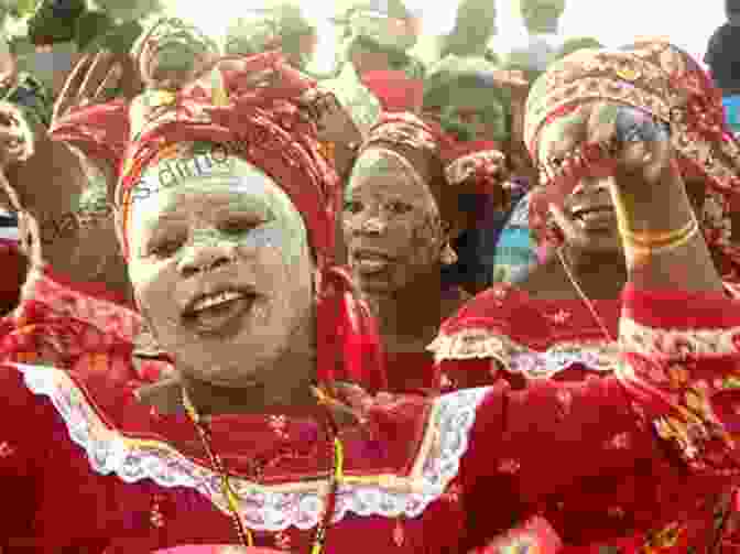 A Group Of People Performing A Traditional Mozambican Dance, With Vibrant Costumes And Rhythmic Movements In A Mozambique Minute: 3 Years In Maputo And More