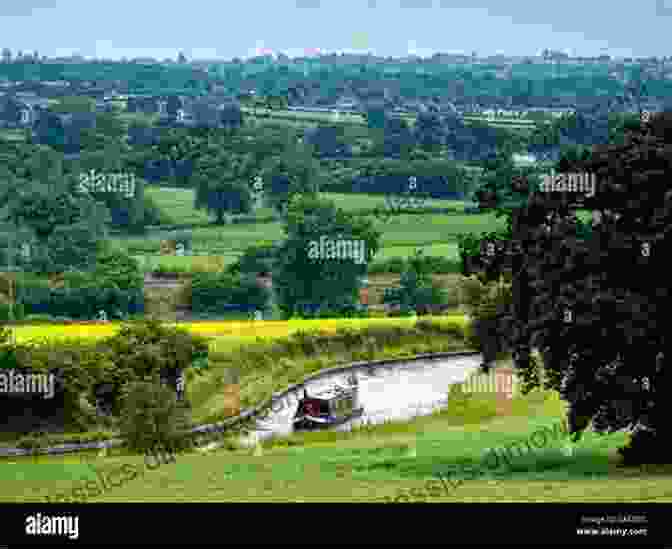 A Narrowboat Cruising Along The Coventry Canal, Surrounded By Lush Greenery. Cruising The Coventry Canal (with One Eye On Its History)