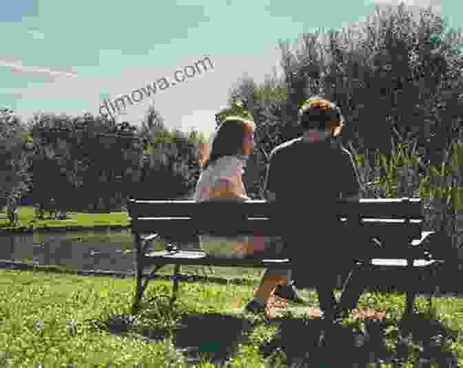 A Serene Reflection Of A Person Sitting On A Bench In A City Park, Surrounded By Lush Greenery And A Tranquil Pond. City Parks: Public Spaces Private Thoughts