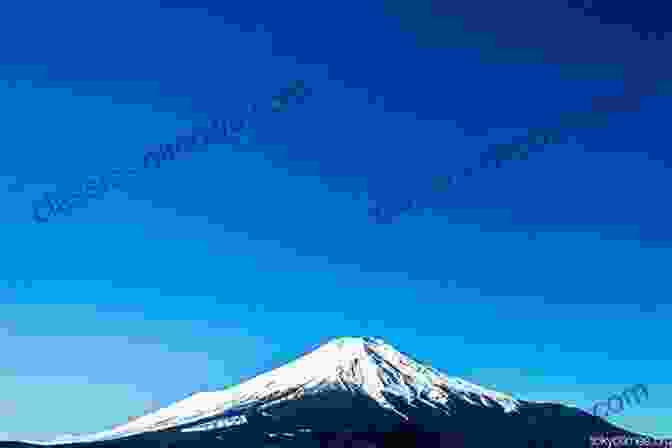 A Stunning Image Of Mount Fuji, Its Snow Capped Peak Piercing The Blue Sky. WHY I M CRAZY ABOUT JAPAN: Heartwarming And Rib Tickling Stories From The Land Of The Rising Sun